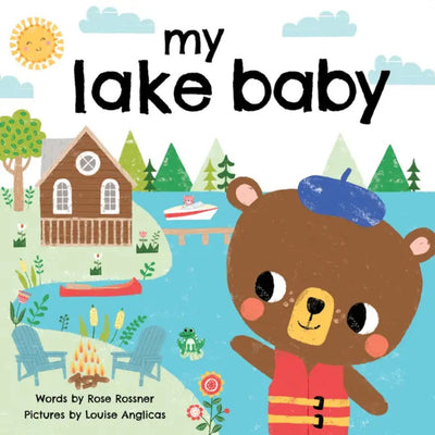 The my lake baby board book by Sourcebooks features a bear in a life jacket and blue hat waving by a lakeside cabin, dock, canoe, and trees—inviting little ones to discover lakeside adventures under the sun and clouds.