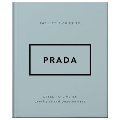 The Little Guide to Prada (hardcover) by Ingram Publishing features a light blue cover with PRADA in a bold black-bordered rectangle and the subtitle Style to Live By, Unofficial and Unauthorized—a chic tribute to luxury fashion.