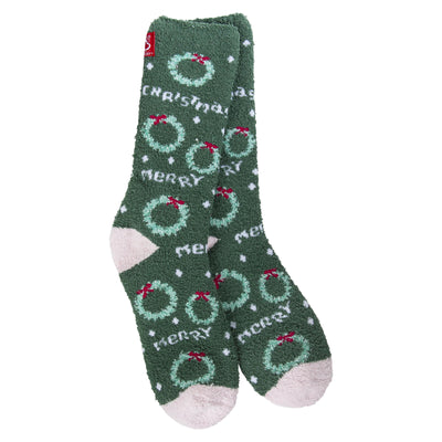 The World's Softest Socks Merry Christmas Cozy Crew Slipper Socks feature green fuzzy polyester, white heels and toes, festive wreaths, red bows, white dots, and "Merry Christmas" text. Women's one size fits most for cozy holiday comfort.