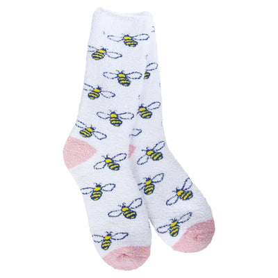 The Bee Kind Cozy Crew Slipper Socks by Worlds Softest Socks are made from soft polyester, featuring pink heels and toes with cartoon bees in black/yellow stripes and blue wings. These cozy, white fuzzy socks are one size fits most and ideal for adding charm to any wardrobe.