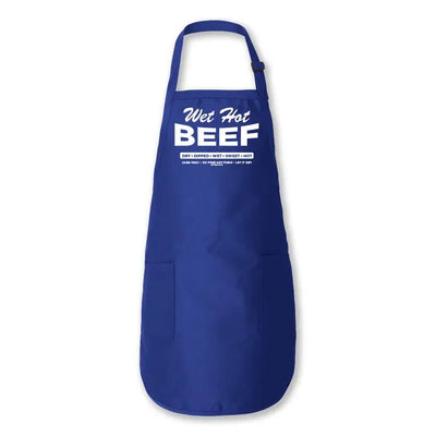 The Wet Hot Beef Apron by Transit Tees is blue with white text saying Wet Hot BEEF, including small text below, ideal for Chicago Italian Beef fans. It features a neck loop and two front pockets, perfect to support small businesses in style.