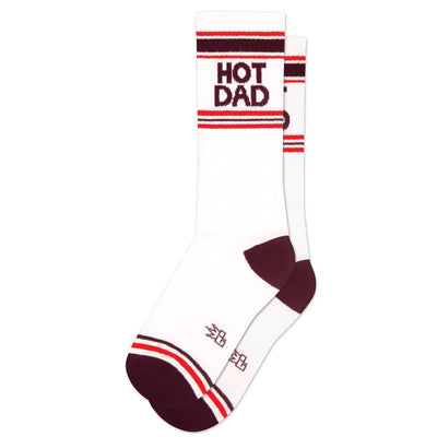 Upgrade your self-care with Gumball Poodle’s Hot Dad Gym Crew Socks—white with bold red toes, heels, and stripes, plus “HOT DAD” printed near the top.