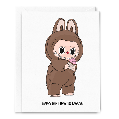 The Happy Birthday to Layuyu Card by Sammy Gorin LLC features original art of a cute character in a brown bunny costume holding a pink cupcake, with HAPPY BIRTHDAY TO LAYUYU on the front and a blank inside for your message.