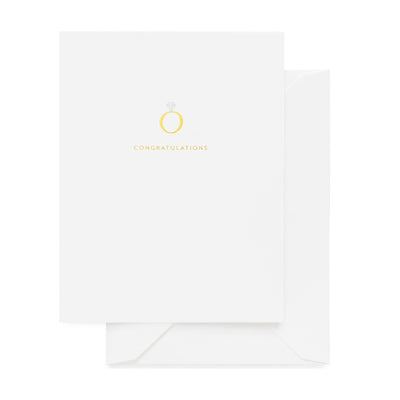 The Sugar Paper Engagement Ring Greeting Card features a gold foil ring and diamond above “CONGRATULATIONS” in gold letters, letterpress printed on white card stock and paired with a matching envelope.