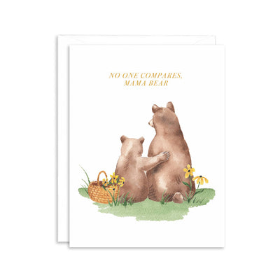 The No One Compares Mama Bear Greeting Card by Paper Betty features an illustration of a mother bear and cub on grass with yellow flowers, the cub reaching for her back. A basket adds charm, making it the perfect Mothers Day card. Crafted on luxe felt paper, it reads: No one compares, Mama Bear.