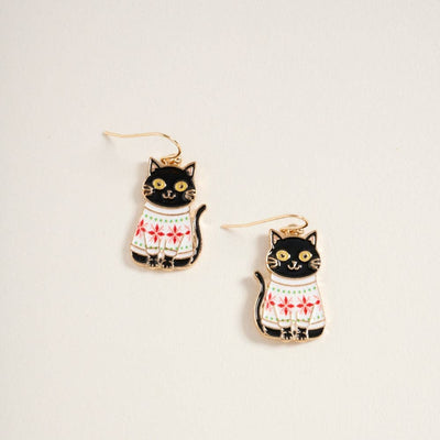 Designature New York's "Cat in Christmas Sweater Hook Earrings Holidays" are 0.75-inch zinc earrings shaped like black cats in white sweaters with red patterns, displayed on a light background. Made in China.
