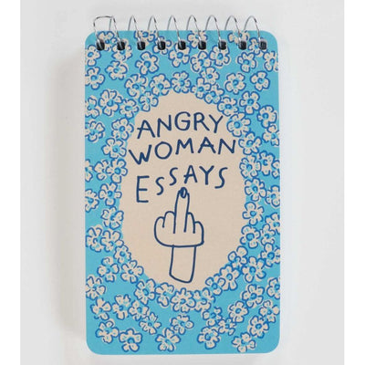 The Blue Q Angry Woman Essays Spiral Notebook features a blue and cream 3x5 inch design with a floral border, handwritten “ANGRY WOMAN ESSAYS,” and a hand giving the middle finger—perfect for unique women’s gifts.