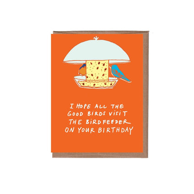 La Familia Greens Birdfeeder Birthday Greeting Card features two birds on a cheery orange background, printed on FSC certified paper with a recycled kraft envelope. Message: I hope all the good birds visit the birdfeeder on your birthday.