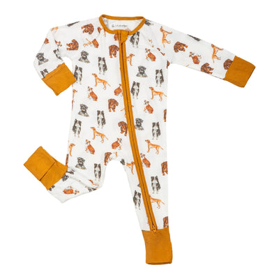 The LollyBanks Woof Woof Dogs Baby Bamboo 2-Way Zipper Pajamas is a white, breathable onesie with brown cuffs and playful dog prints in brown, orange, and gray, plus a convenient 2-way zipper for easy changes.