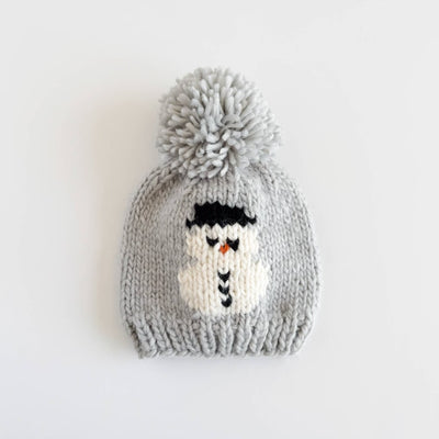 Knitted gray beanie with a snowman design on a white background