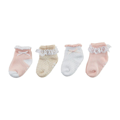 The Pink Pointelle Baby Sock Set by Mud Pie includes four pairs in pastel colors: two pink, one white, and one beige. Each pair features decorative lace or ruffles around the ankle with small bows on some, ideal for a charming gift box presentation.