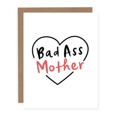 The Bad Ass Mother Card by pretty by her is a handmade A2 greeting card on matte cardstock with a heart outline. Inside, Bad Ass is in black and Mother in red, paired with a rustic brown envelope for an ideal presentation.