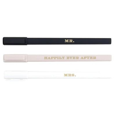 The Boxed Wedding Pens Set by Santa Barbara Design Studio features three refillable pens—black with MR. in gold, beige with HAPPILY EVER AFTER, and white with MRS.—each with a matching cap, ideal for guest books.