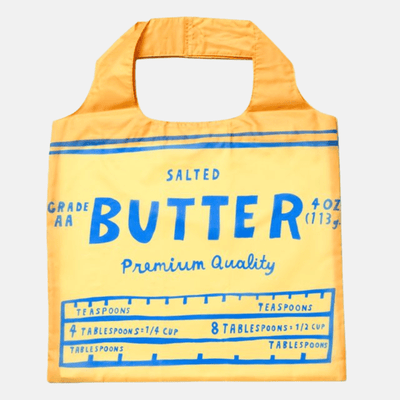 The Butter Art Sack® Reusable Tote by Yellow Owl Workshop is a yellow recycled bag styled like a butter wrapper, featuring blue “Salted Butter,” “4 oz,” and a conversion chart—a playful, eco-friendly tote for modern shoppers.