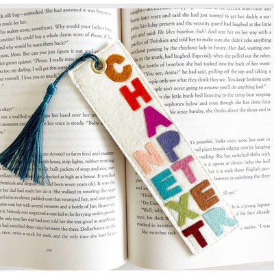 The Milo & Mollie Next Chapter Felt Bookmark features colorful CHAPTER NEXT letters and a blue tassel—an ideal gift for book lovers.