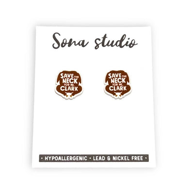 A pair of brown Save the Neck Turkey Earrings by Sona Studio on a white card. These handmade, hypoallergenic earrings are lead & nickel free and read SAVE THE NECK FOR ME, CLARK.
