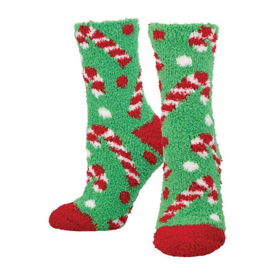 Socksmith's Warm & Cozy Candy Canes Slipper Socks feature fuzzy green polyester with red toes, white polka dots, and candy cane designs. Shown on a plain white background; available in both men's and women's sizes.