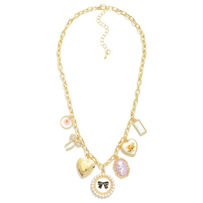 The Tazza Charm Necklace from Judson & Company features mixed metal chain links with resin charms including a pearl bow, heart, cameo, and florals. Each charm has unique shapes and vibrant details. It includes a lobster clasp and an adjustable chain for personalized wear.