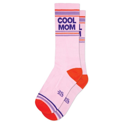 The Cool Mom Unisex Socks by Gumball Poodle feature pink mid-calf length, red toes and heels, purple and red stripes near the top, and bold purple COOL MOM lettering—a stylish choice for anyone.