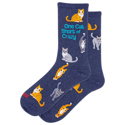 HOTSOX Womens One Cat Short of Crazy Crew Socks in navy feature embroidered orange, gray, and white cats with turquoise text. Made from soft, machine washable cotton for comfort and easy care.