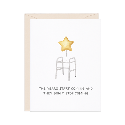 The Years Start Coming — Funny Millennial Birthday Card by Amy Zhang features a walker with a gold star balloon and the phrase: "THE YEARS START COMING AND THEY DON’T STOP COMING." Perfect for any birthday celebration!.