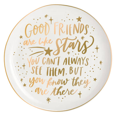 The soiree-sisters Good Friends Are Like Stars Round Ceramic Trinket Tray features gold and peach lettering with star illustrations—a thoughtful gift for her and a beautiful way to celebrate friendship.