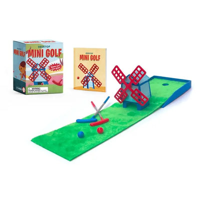 Mini golf game set with windmill and balls, featuring a box in the background.