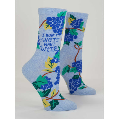The Blue Q Dont Not Want Wine Womens Crew Socks are soft light blue combed cotton socks decorated with green and yellow leaves, purple grape clusters, and the phrase I DONT NOT WANT WINE among the grapes.