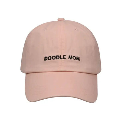 The Hatphile DOODLE MOM Baseball Cap in Pink features DOODLE MOM embroidered in black. Made of cotton, it has an adjustable strapback for the perfect fit. Hand wash only to preserve its quality and vibrant look.