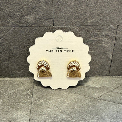A pair of Doodle Enamel Stud Earrings, nickel-free and lead compliant from Prep Obsessed Wholesale, displayed on a scalloped-edge THE FIG TREE card against a textured gray stone background.