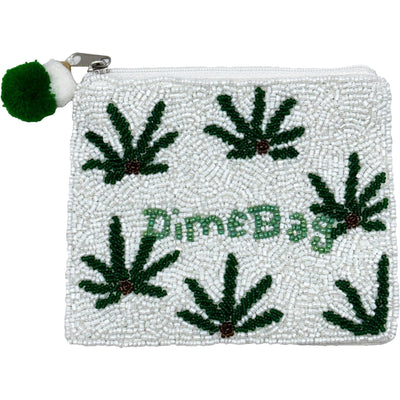 The Dime Bag Beaded Coin Pouch by Pizzazz, Inc. is a white cotton zippered pouch made in India, featuring beaded green marijuana leaves, Dime Bag text, and a green-white pom-pom zipper pull.
