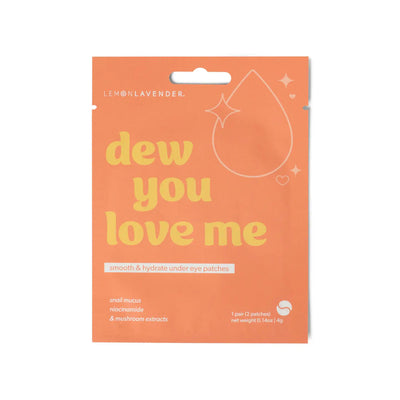DM Merchandising’s Dew You Love Me Smooth & Hydrate Foil Under Eye Patches by Lemon Lavender come in orange packaging with a water droplet and sparkles, featuring antioxidant-rich snail mucus, niacinamide, and mushroom extracts. Inspired by Korean skincare.