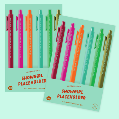 Two packs of The Life of a Showgirl Swiftie Jotter Set by Talking Out of Turn, each featuring soft-touch barrels and fine-point gel ink in red, purple, pink, orange, green, and blue, displayed on a light teal background.