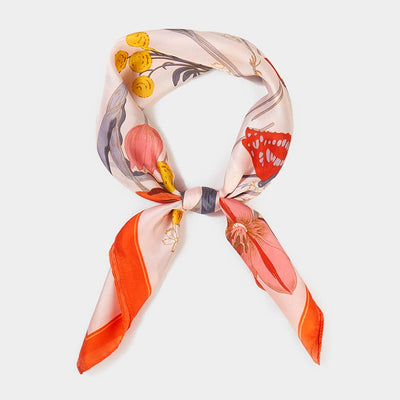 Floral patterned scarf with orange, red, and yellow colors on a light background