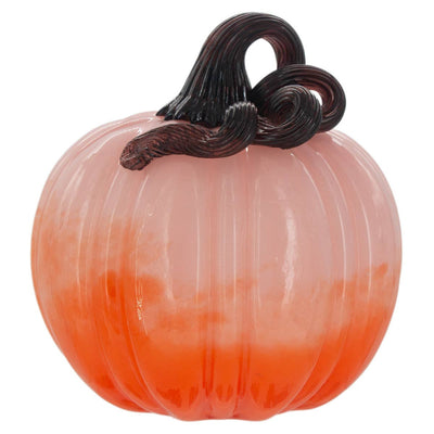 The Boston International Small Ombre Pink & Orange Glass Pumpkin features a light pink-to-orange gradient and a dark curly stem, making it perfect decor for your home.