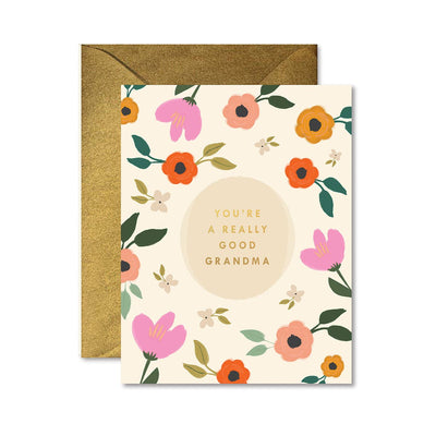 The Ginger P. Designs Really Good Grandma Greeting Card showcases colorful flowers around the phrase YOURE A REALLY GOOD GRANDMA, with an elegant touch provided by a gold foil card envelope.