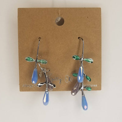 Hermia Hand Painted Earrings by BETTYOH INC feature silver vine dangles with green leaf accents and blue and purple teardrop beads, displayed on a brown cardboard backing.