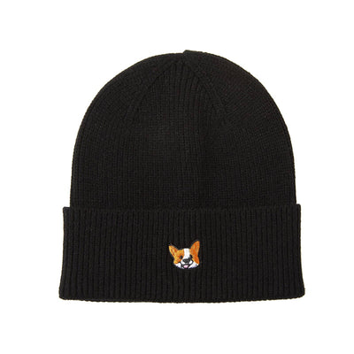 The HATPHILE Happy Corgi Embroidered Knit Beanie is a black, soft-knit hat with a folded brim and features a small orange and white corgi face embroidered on the front for all-day comfort.