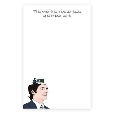 The Mysterious and Important Notepad by Sammy Gorin LLC features an illustration of a man in a suit with his head resembling an office, including a desk-bound figure. It comes wrapped in cellophane with cardboard backing, highlighting the artworks mysterious and important nature.