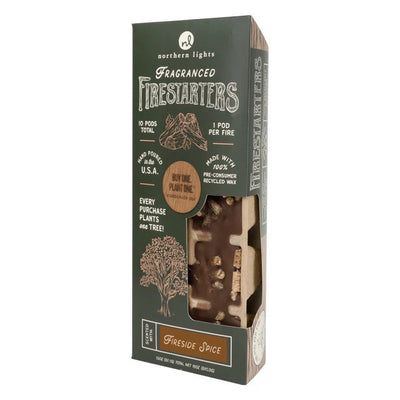 Northern Lights Fireside Spice Firestarters include 10 fragranced pods made from recycled wax. The eco-friendly box features a window and highlights a tree-planting initiative.