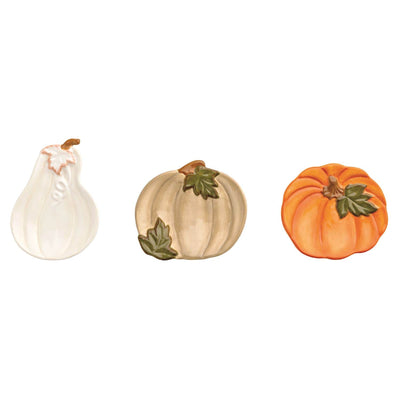 The Mud Pie Gather Tidbit Dishes set features three decorative pumpkins—white with a brown stem, tan with green leaves, and orange with green leaves—each resembling hand-painted stoneware on a white background.