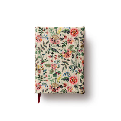 The Gracie Quilted Journal by Rifle Paper Co. features a quilted bookcloth cover with vibrant pink, red, and yellow flowers and green leaves on a light background, plus a red ribbon bookmark in its hardbound design.