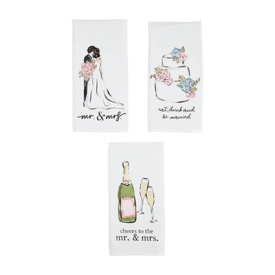 Mud Pies Wedding Sentiment Towels, made from soft cotton and measuring 26 x 16.5, feature charming designs: a couple illustration with mr. & mrs., a wedding cake with eat, drink and be married, and champagne glasses with cheers to the mr. & mrs.