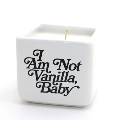 The Lenny Mud Not Vanilla Baby Hand Poured 8 oz. Soy Candle features a white ceramic holder with black text that says, “I am not vanilla, baby.”.
