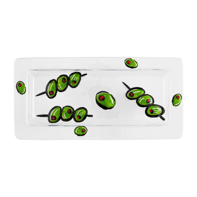 The Olive Glass Tray by Mud Pie is a rectangular white ceramic piece featuring hand-painted green olives and red pimentos, artistically arranged in pairs and trios on skewers, offering an elegant touch.