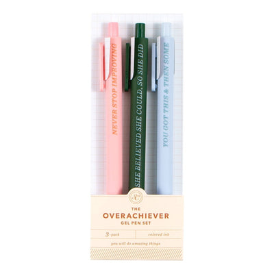 Studio Calico’s The Overachiever Pen Set includes three gel pens—pink, green, and blue—each with a motivational phrase. Perfect for journaling or gifting, they come vertically packaged in a clear box.