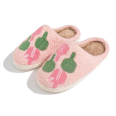 The Judson & Company Pickleball Slippers feature a cozy, plush polyester interior and casual slip-on design, with a sturdy rubber sole. They come in womens size and showcase colorful ice cream cones in green, pink, and red on pink fluffy slippers.