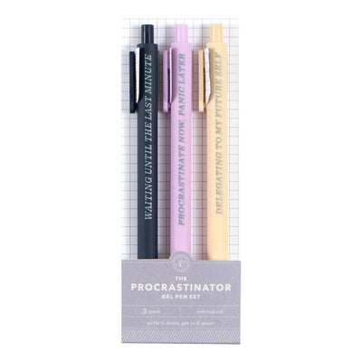 The Procrastinator Pen Set by Studio Calico includes three gel pens in black, purple, and yellow with witty procrastination phrases—perfect for adding humor to your notes or gifting to anyone who loves a good laugh!.