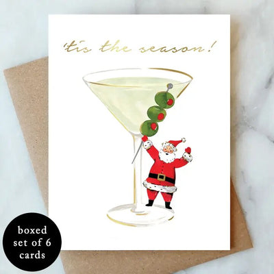 Send festive cheer with the Abigail Jayne Design Santa Martini Holiday Cards – Box of 6, featuring Santa with a martini and "tis the season!" in gold foil. Includes envelopes, perfect for gifting.
