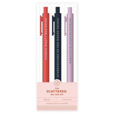 The Scattered Pen Set by Studio Calico includes three gel pens in red, blue, and lavender with funny phrases—ideal stationery for list-makers or journalers.